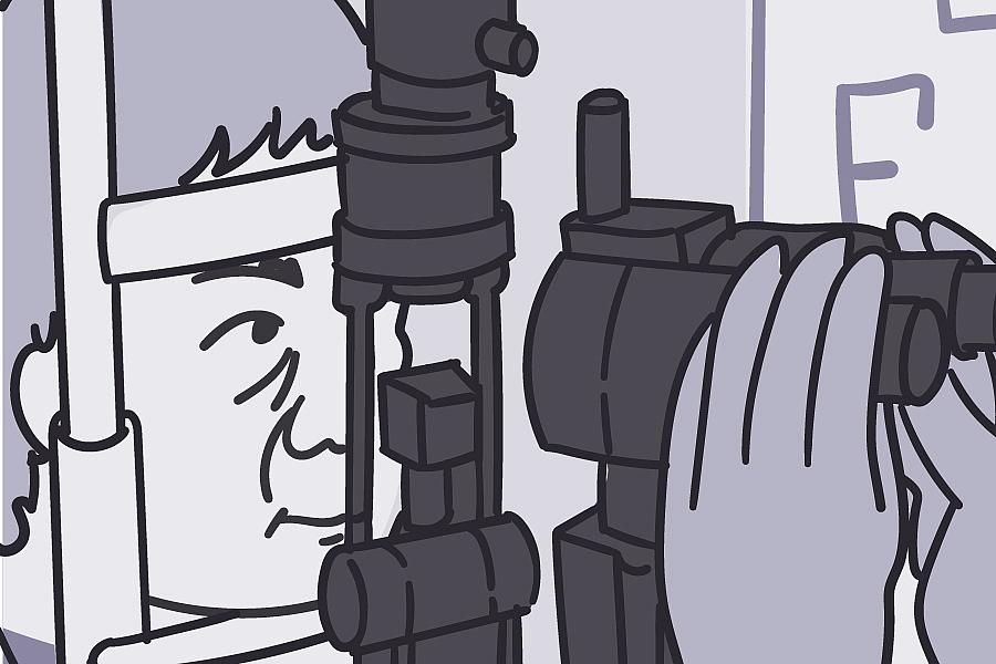 Eye doctor giving person an eye exam.